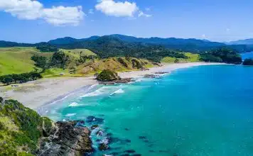 aerial view of beach with mountains